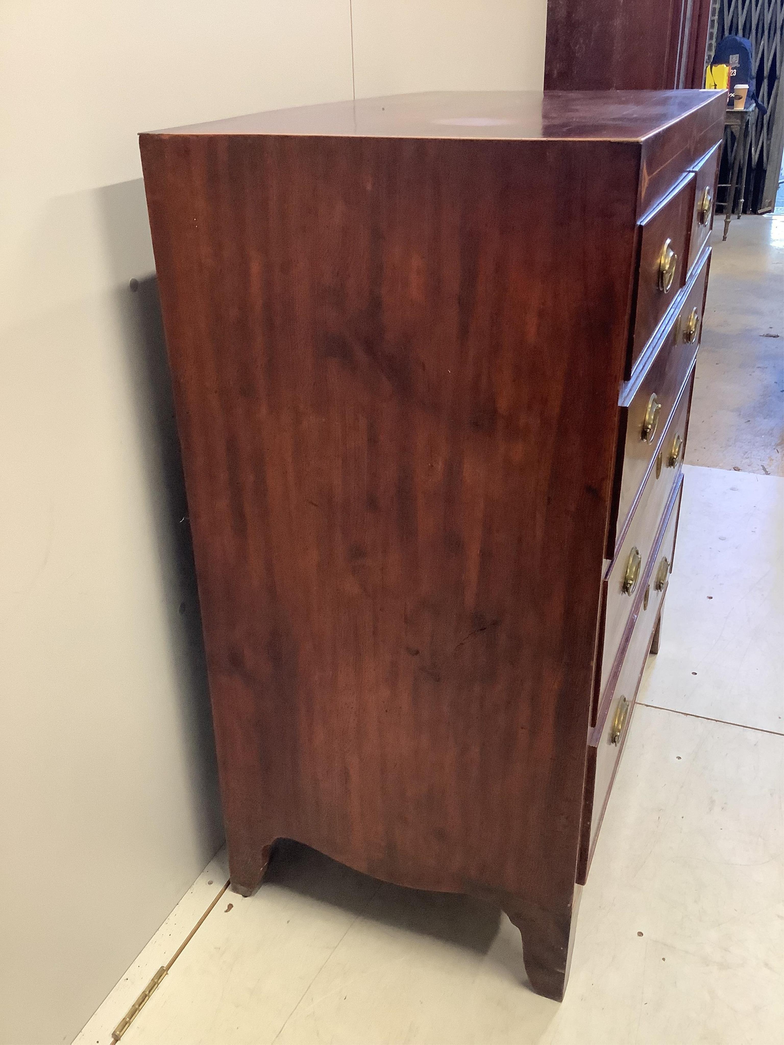 A Regency inlaid mahogany chest, width 87cm, depth 50cm, height 106cm. Condition - fair, top slightly faded, spot and ring marked.